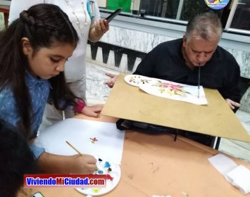 Joel Ramos en el Dia Munidal Pintor Boca y Pie